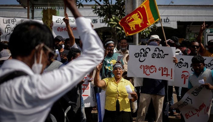 Protestors shout slogans during a protest demanding the resignation of Sri Lankas acting President Ranil Wickremesinghe, in Colombo, Sri Lanka July 19, 2022. — Reuters