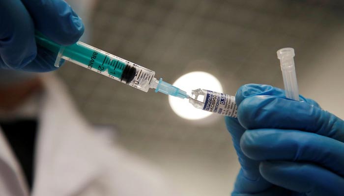 A medical worker holds a syringe with Sputnik V (Gam-COVID-Vac) vaccine against the coronavirus disease (COVID-19) before administering injection at a vaccination centre in a shopping mall in Saint Petersburg, Russia February 24, 2021. — Reuters/File