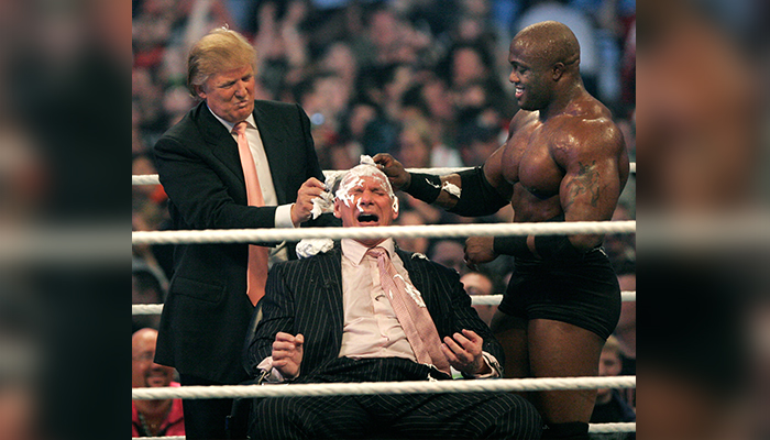 In this file photo taken on April 1, 2007, WWE chairman Vince McMahon (C) has his head shaved by Donald Trump (L) and Bobby Lashley (R) after losing a bet in the Battle of the Billionaires at the 2007 World Wrestling Entertainment´s Wrestlemania at Ford Field in Detroit, Michigan. — AFP