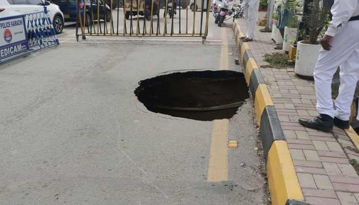 Sinkhole that has emerged on the Dr Ziauddin Ahmed Road near CM House. — Reporter