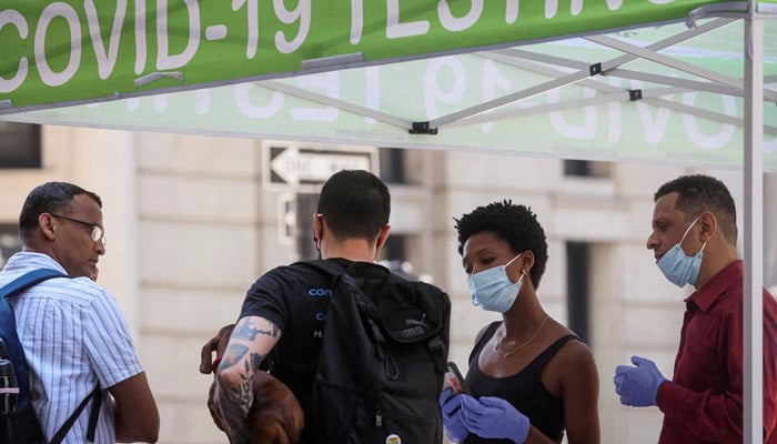 People wait to take coronavirus disease (COVID-19) tests at a pop-up testing site in New York City, US, on July 11, 2022. — Reuters