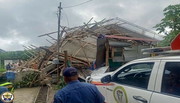 Emergency crew assess the damage outside a building that collapsed during the earthquake, in La Trinidad, Benguet, Philippines July 27, 2022. — Reuters via Public Information Service-Bureau of Fire Protection