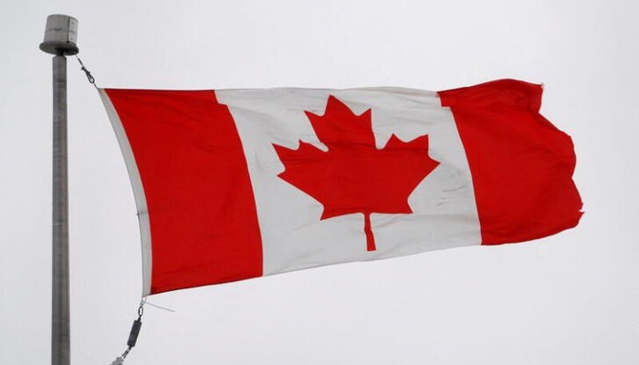 The Canadian flag flutters in the wind in Quebec City, February 26, 2010. REUTERS/Mathieu Belanger