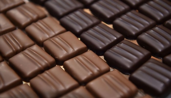 Image showing some cubes of dark and milk chocolate. —Christophe Archambault/AFP/Getty Images