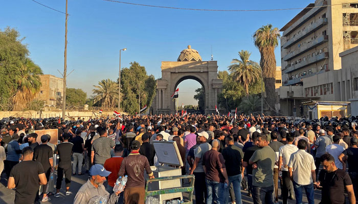 Supporters of Iraqi Muqtada al-Sadr protest outside the main gate of Baghdads Green Zone on July 27, 2022 against the nomination of Mohammed Shia al-Sudani for the prime minister position. — AFP