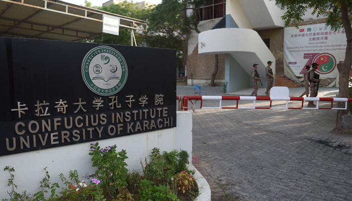 Rangers stand guard nearby the blast site a day after a suicide attack on a van near the Confucius institute which is the cultural programme that China operates at universities around the world at the Karachi University in Karachi on April 27, 2022. — AFP