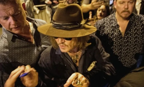 Johnny Depp wins hearts as he clicks pics, signs autographs for fans in France