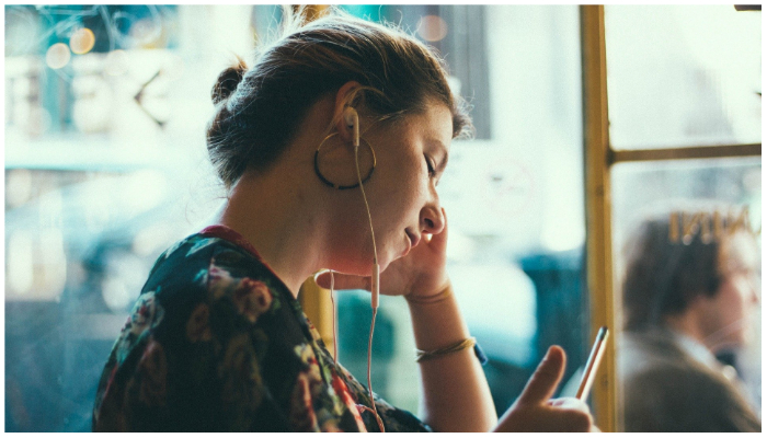 Representational image of a sad woman looking at her phone.  — Pixabay/ StockSnap