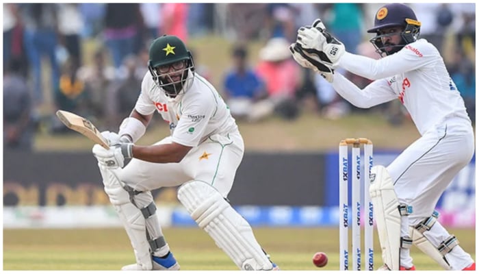 Pakistans Imam-ul-Haq (L) plays a shot as Sri Lankas wicketkeeper Niroshan Dickwella watches during the fourth day of the second cricket Test match between Sri Lanka and Pakistan at the Galle International Cricket Stadium in Galle on July 27, 2022. — AFP