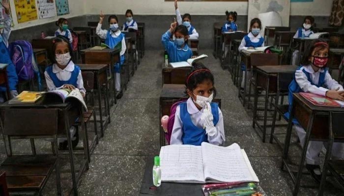 A representational image of students attending classes wearing masks as a protective measure against coronavirus. — Reuters/File