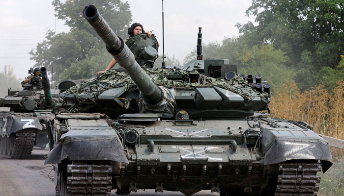 Service members of pro-Russian troops drive tanks in the course of Ukraine-Russia conflict near the settlement of Olenivka in the Donetsk region, Ukraine July 29, 2022.— REUTERS/Alexander Ermochenko