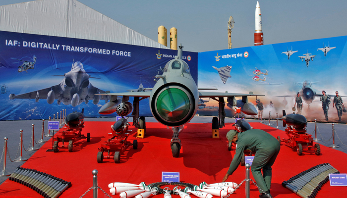 An Indian Air Force personnel arranges ammunitions in front of MIG-21 fighter plane at DefExpo 2020 in Lucknow, India, February 5, 2020. — Reuters/ Pawan Kumar/File Photo