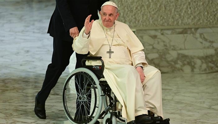 Pope Francis sits in a wheelchair at the Vatican on May 28. — AFP/File
