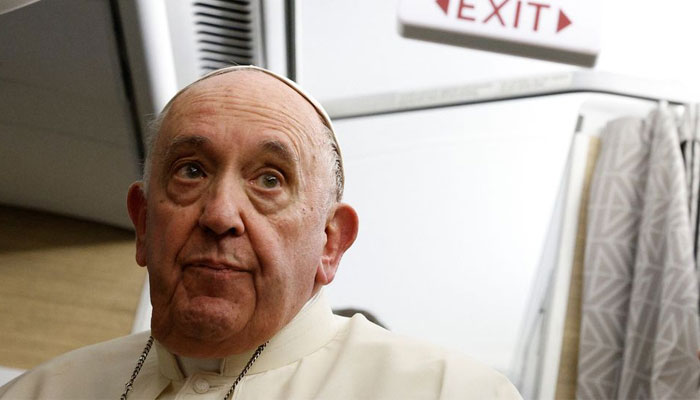 Pope Francis holds a news conference aboard the papal plane on his flight back after visiting Canada, July 29, 2022. — Reuters