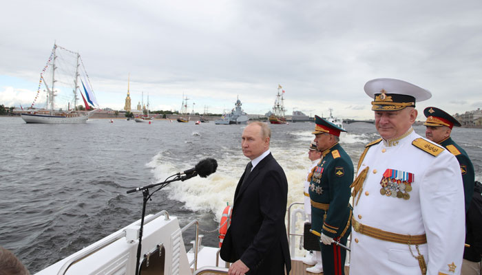 Russias President Vladimir Putin, Defence Minister Sergei Shoigu and head of the Russian navy Admiral Nikolai Yevmenov take part in a parade marking Navy Day in Saint Petersburg, Russia July 31, 2022. — Sputnik/Kremlin via Reuters