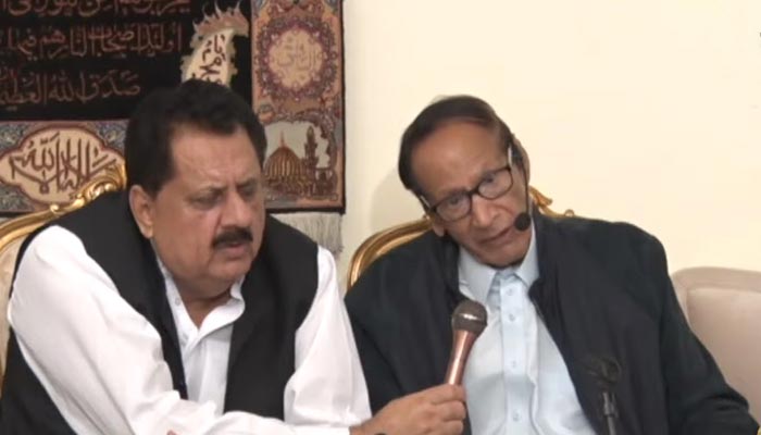 PML-Q senior leader Chaudhry Shujaat (R) addresses a press conference flanked by Federal Minister Tariq Bashir Cheema in Islamabad on August 1, 2022.  — Screengrab via PTV News
