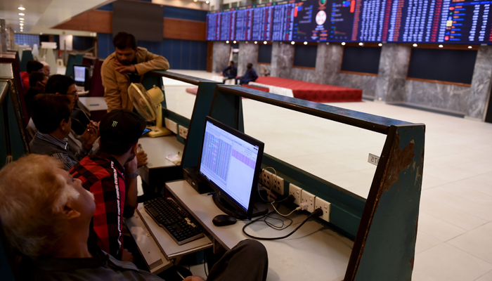 Stockbrokers watch the latest share prices during a trading session at the Pakistan Stock Exchange (PSX) in Karachi on February 3, 2020. — AFP/Files