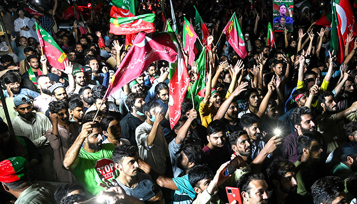 In this picture taken on July 26, 2022, supporters of former prime minister Imran Khan, gather to celebrate after Supreme Court declared that Khan´s candidate should be next Chief Minister of the Punjab province, nullifying provincial assembly deputy speaker´s last week ruling in Lahore. — AFP