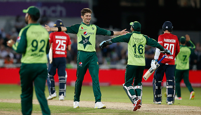 Cricket - First Twenty20 International - England v Pakistan - Trent Bridge, Nottingham, Britain - July 16, 2021 Pakistans Shaheen Afridi celebrates with teammates after taking the wicket of Englands Matt Parkinson to win the match Action Images. — Reuters