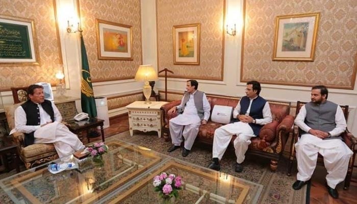 PTI Chairperson Imran Khan (L) and Punjab Chief Minister Chaudhry Pervez Elahi and PML-Q leader Moonis Elahi. — PID/File