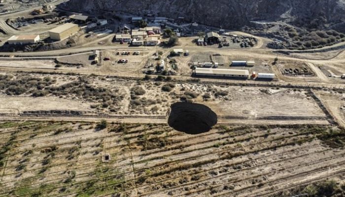 The sinkhole in Chiles Atacama deser is 32 meters (104 feet) across and twice as deep - AFP