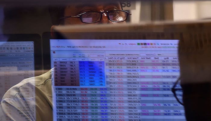 A stockbroker monitors the share prices during a trading session at the Pakistan Stock Exchange (PSX) in Karachi on June 3, 2022. — AFP