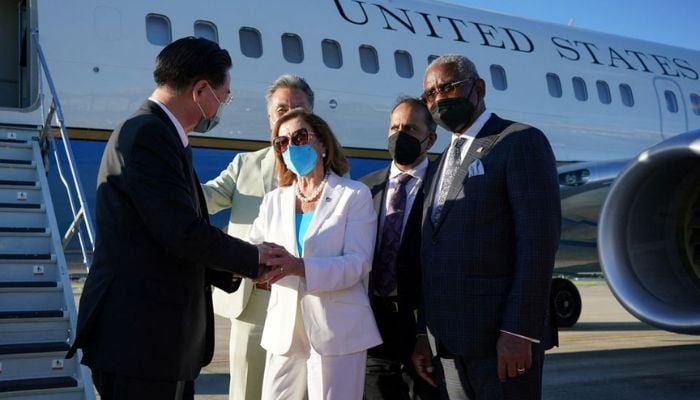 US House of Representatives Speaker Nancy Pelosi talks with Taiwan Foreign Minister Joseph Wu before boarding a plane at Taipei Songshan Airport in Taipei, Taiwan August 3, 2022. — Reuters