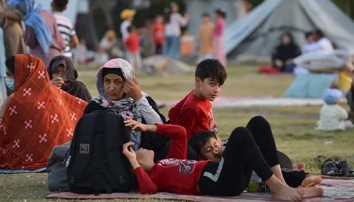 Afghan refugees seeking asylum abroad gather at an open field in protest to demand help from the United Nations High Commissioner for Refugees (UNHCR), in Islamabad on May 7, 2022. — AFP/File