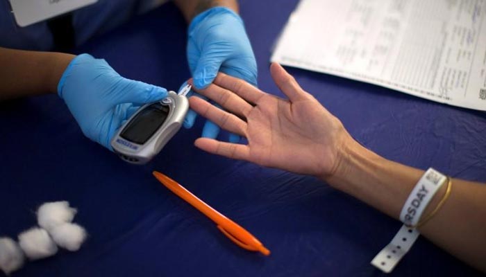 A person receives a test for diabetes during Care Harbor LA free medical clinic in Los Angeles, California September 11, 2014. — Reuters/File