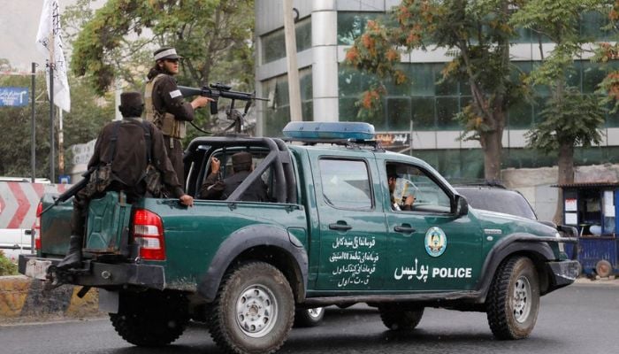 Taliban fighters drive a car on a street following the killing of Al Qaeda leader Ayman al-Zawahiri in a U.S. strike over the weekend, in Kabul, Afghanistan, August 2, 2022. REUTERS