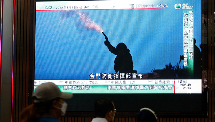 A TV screen shows that Chinas Peoples Liberation Army has begun military exercises including live firing on the waters and in the airspace surrounding the island of Taiwan, as reported by Chinese state television, in Hong Kong, China August 4, 2022. — Reuters