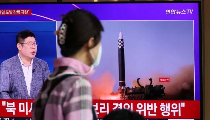 A woman watches a TV broadcasting a news report on North Koreas launch of three missiles including one thought to be an intercontinental ballistic missile (ICBM), in Seoul, South Korea, May 25, 2022.— Reuters