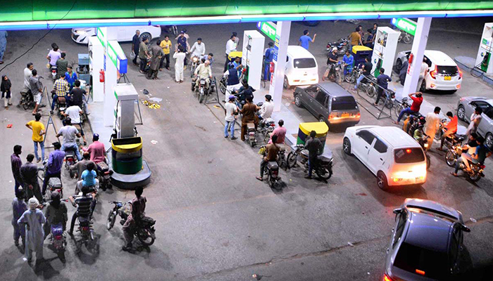 A view of a large number of motorcycles and cars lined up at a petrol pump in Hyderabad, on July 2, 2022. — APP