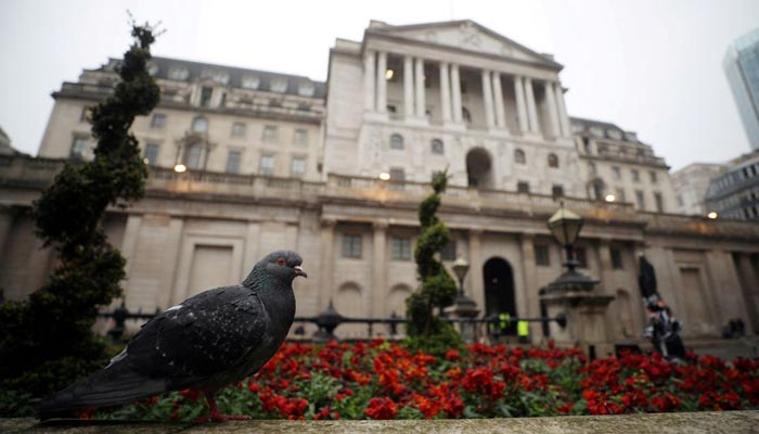 A pigeon stands in front of the Bank of England in London, Britain, April 9, 2018. Picture taken April 9, 2018. — Reuters/File