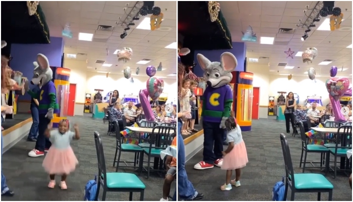 The picture shows a black child trying to high-five a mascot. — Screengrab/Instagram