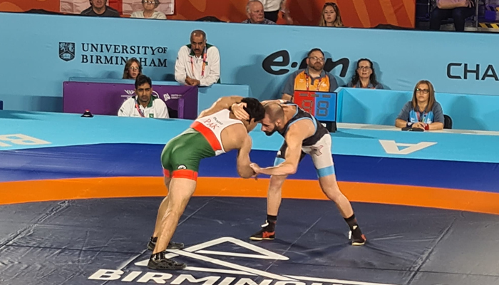 Pakistans wrestler Inayatullah (left) wrestles withMaltas Adam Vella at theCommonwealth Games 2022 in Birmingham, United Kingdom. — Photo by author