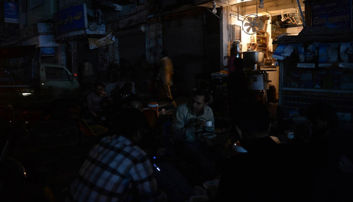 People sitting at a cafe in Pakistan amid loadshedding. — AFP/File