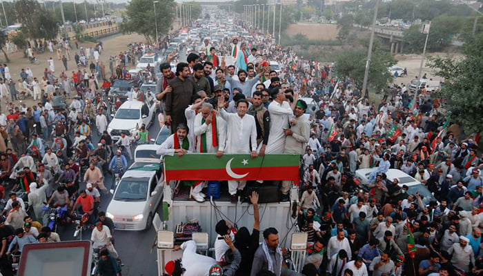 Ousted prime minister and PTI Chairman Imran Khan gestures as he travels on a vehicle to lead a protest march in Islamabad, Pakistan May 26, 2022. — Reuters