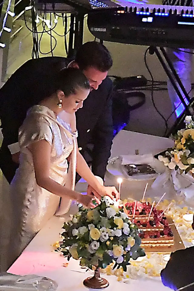 Selena Gomez cutting her birthday cakes
