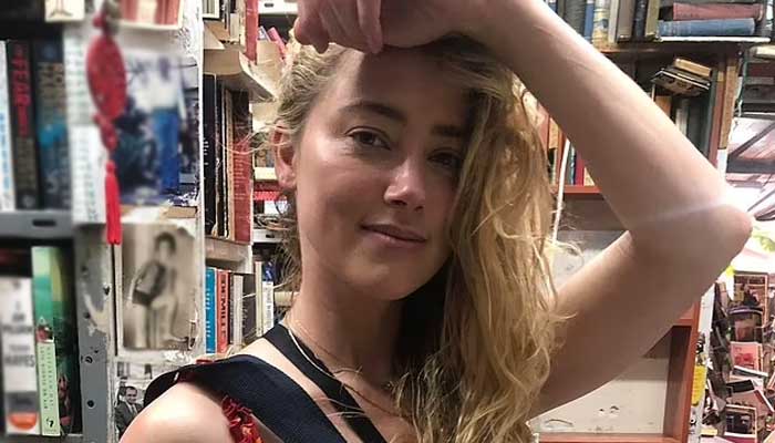 Amber Heard leaves onlookers spellbound with her appearance in red maxi dress