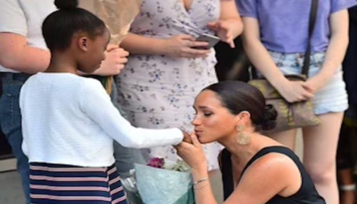 Meghan Markle kissing her own thumb instead of girls hand in picture shared by Tyler Perry?