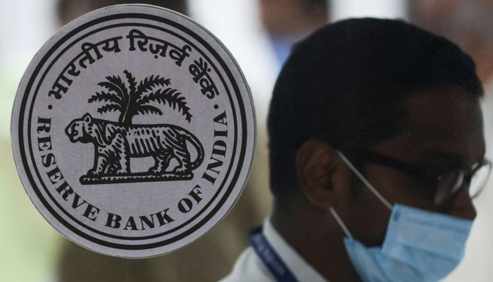 A man walks past the logo of Reserve Bank of India (RBI) inside its headquarters in Mumbai, India, August 5, 2022. — Reuters