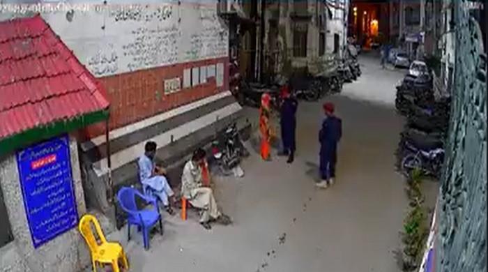 Karachi security guard arrested for slapping, kicking woman outside apartment building