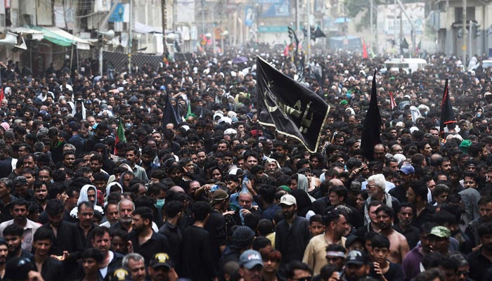 Mourners take part in a procession on the tenth day of Ashura during the Islamic month of Muharram, in Karachi on August 9, 2022. — AFP