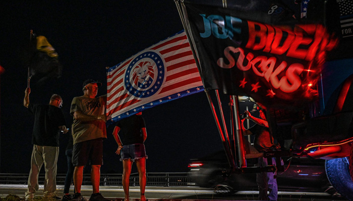 Supporters of former US President Donald Trump stand outside his residence in Mar-A-Lago, Florida on August 8, 2022.-AFP