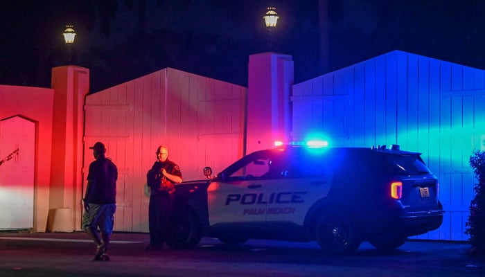 A police car is seen outside former US President Donald Trump´s residence in Mar-A-Lago, Florida on August 8, 2022. -AFP