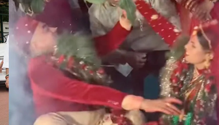 The picture shows a groom and bride fighting.— Screengrab/Instagram