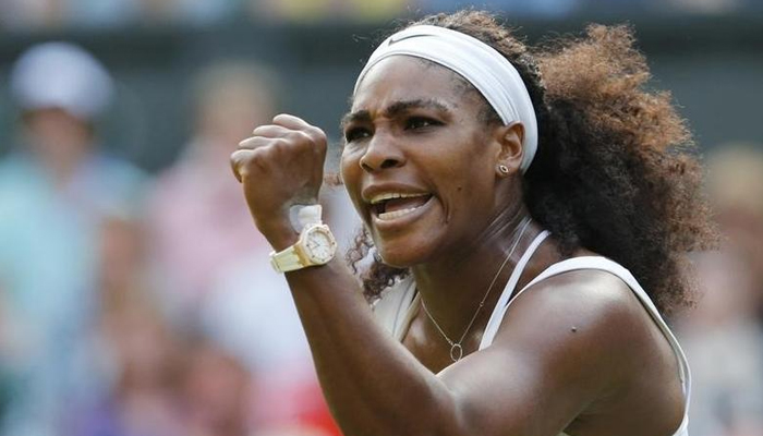 Serena Williams of the USA. celebrates winning a game during her match against Heather Watson of Britain at the Wimbledon Tennis Championships in London, July 3, 2015. — Reuters