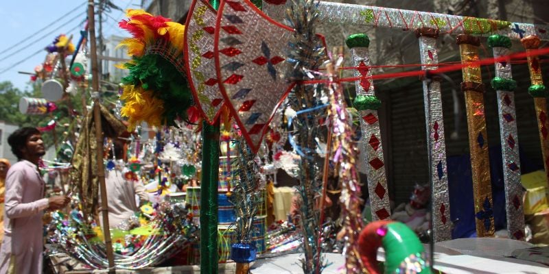 A customer looks over toys at a cart in Kharadar - Image by author