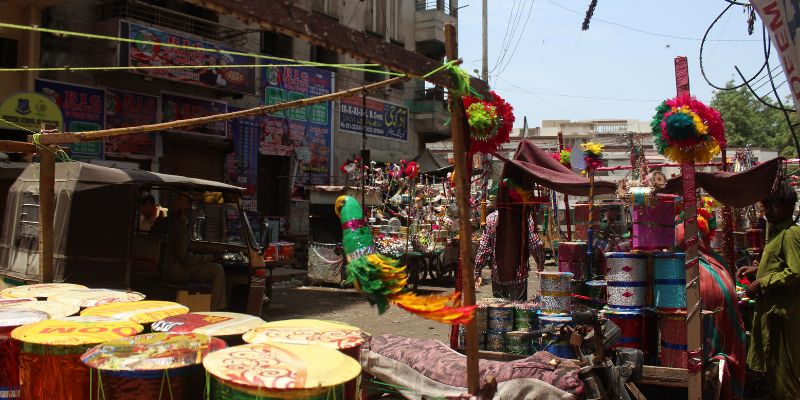 View of the Paria Street in Kharadar with a toy cart in the shot - Image by author